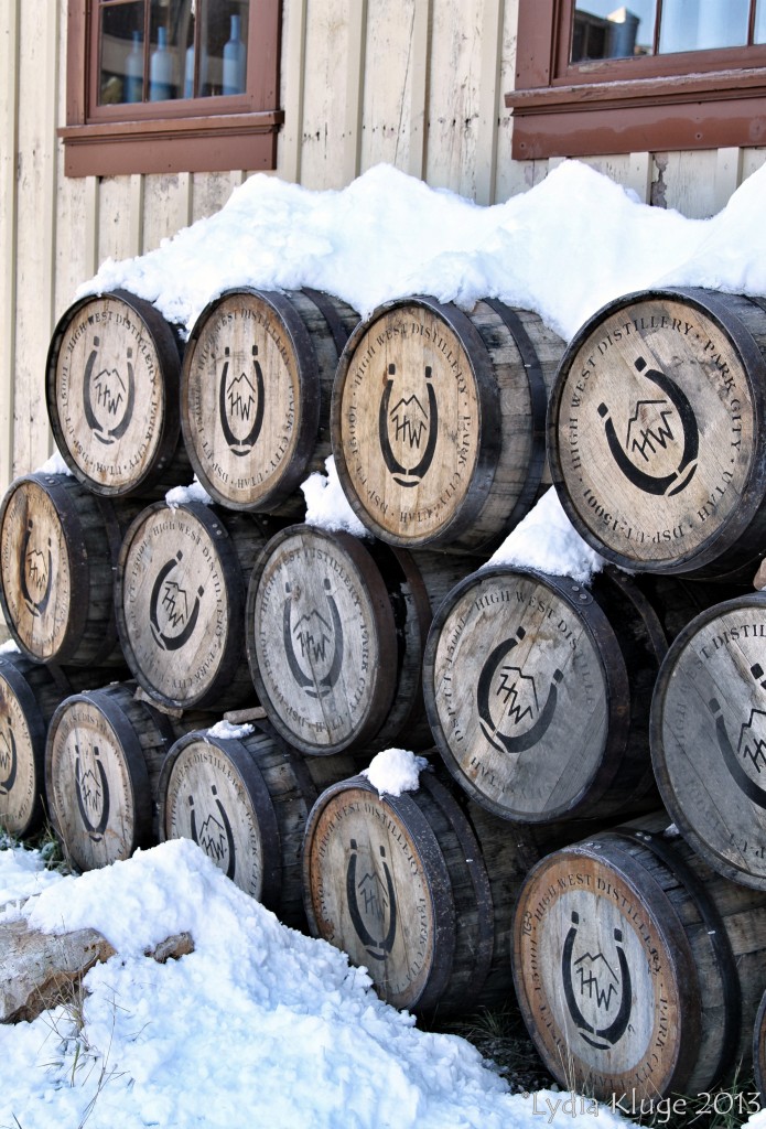 Discarded whisky barrels covered in snow.